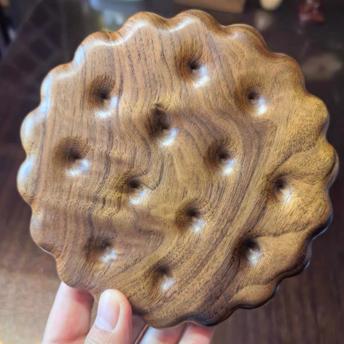 Biscuit shaped wooden trivet made from natural solid wood