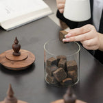Clear glass storage canister with smooth walnut lid finish