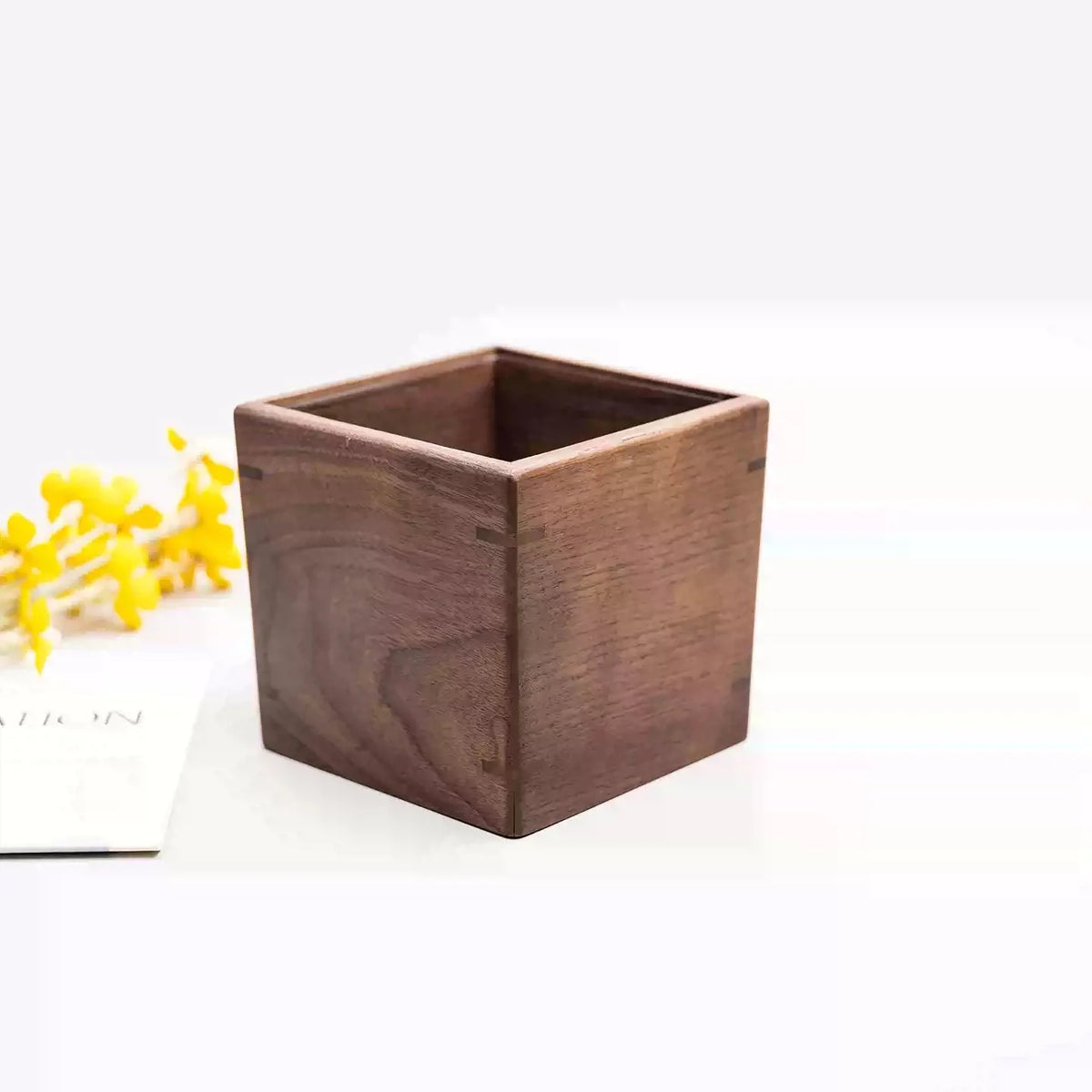 Compact solid walnut desktop bin with minimalist design