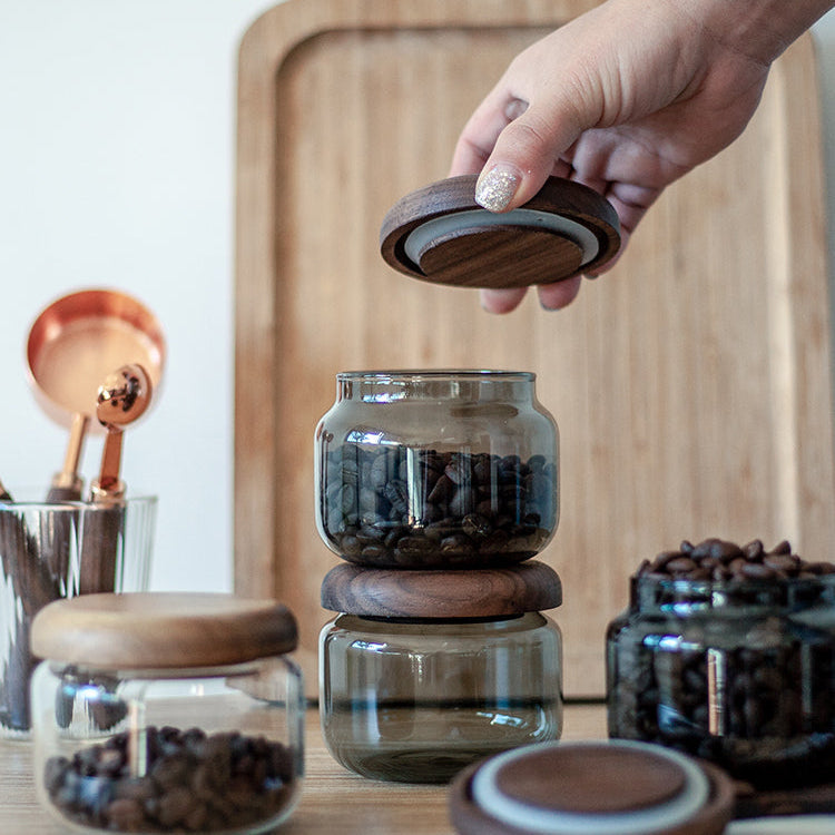 Glass coffee canister with solid walnut lid design