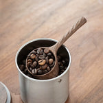 Handcrafted solid walnut coffee scoop with minimalist design