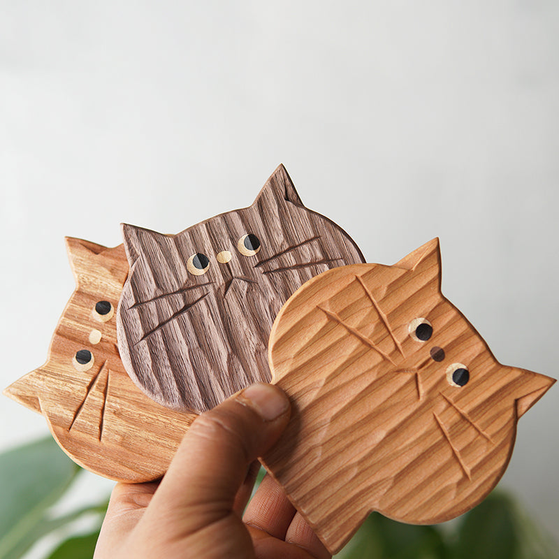 Handcrafted solid wood cat coaster set with playful design