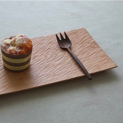 Handcrafted solid wood serving board with flowing design