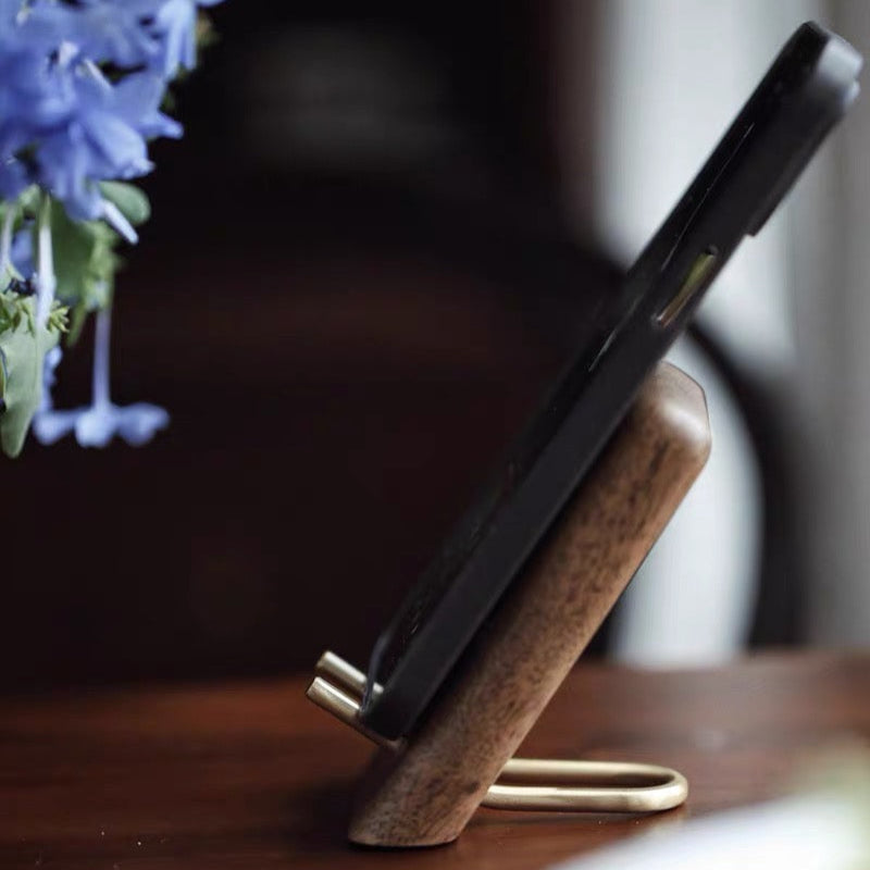 Lean back wooden phone holder made from natural walnut wood