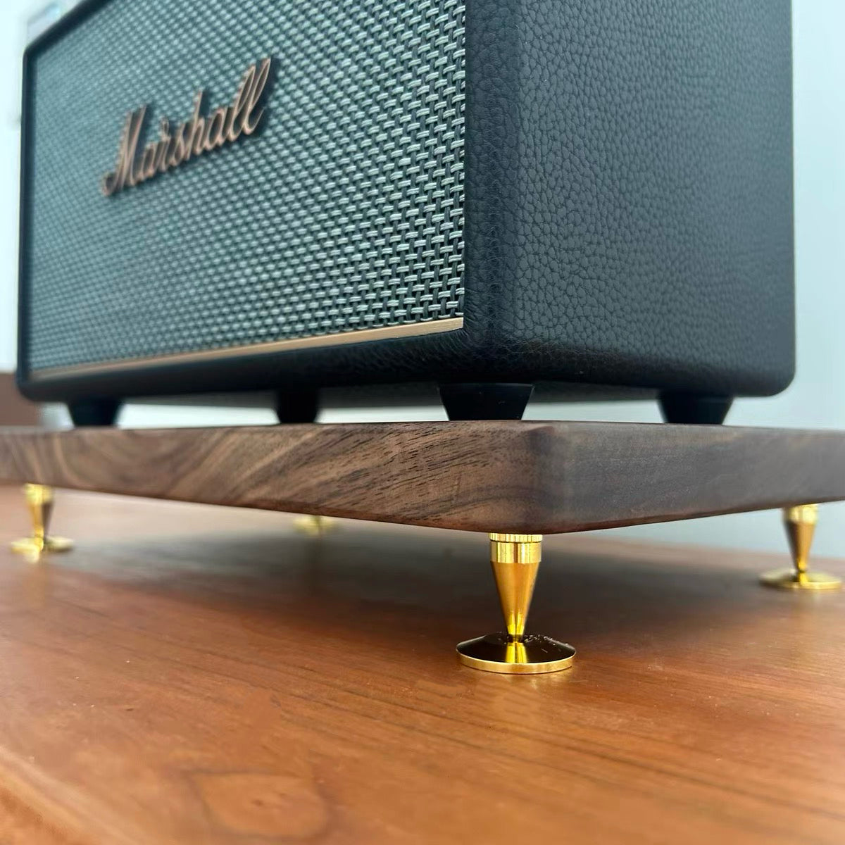 Low rise wooden speaker stand made from natural walnut wood