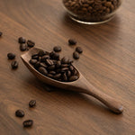 Minimalist walnut coffee scoop for home brewing setup