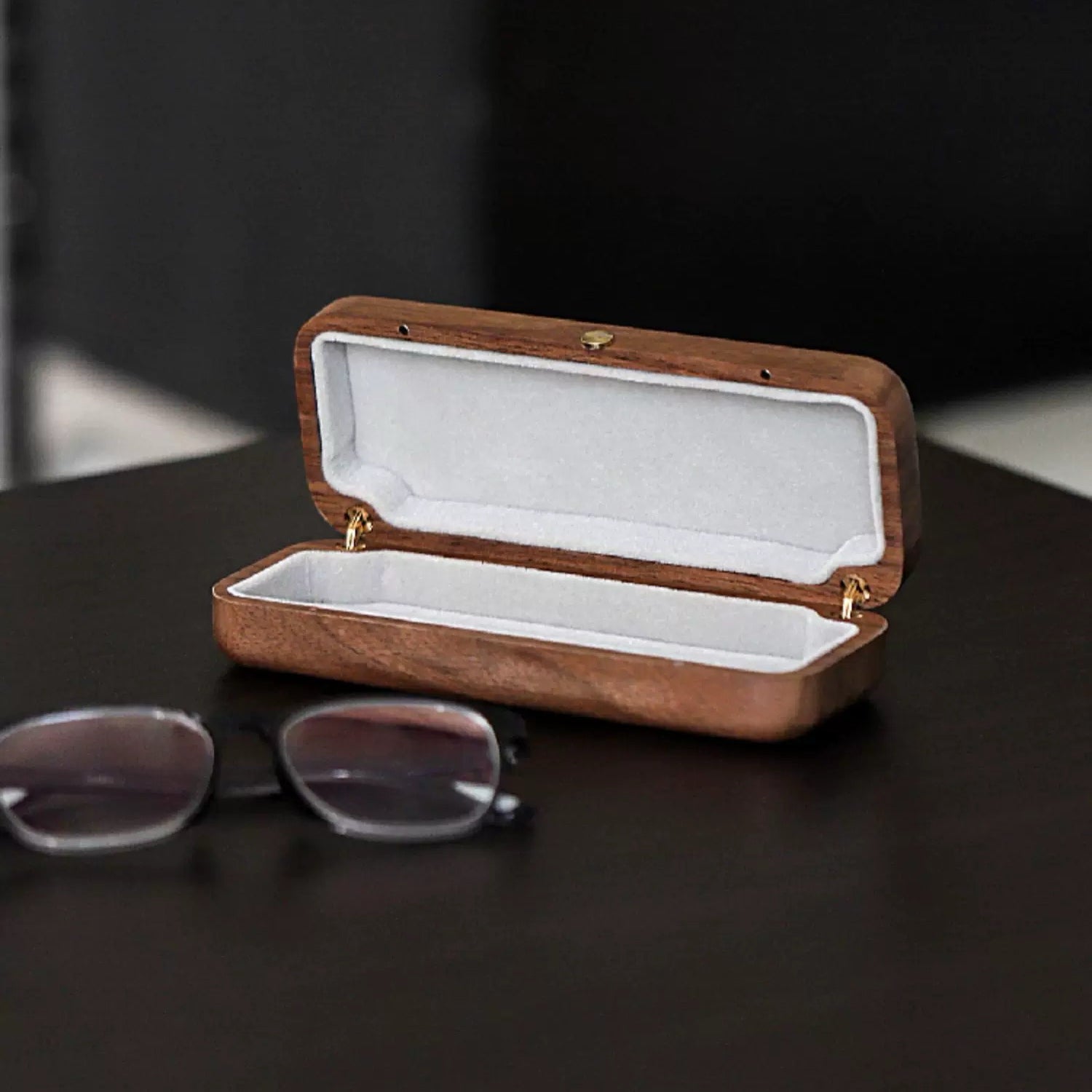 Minimalist walnut glasses case with smooth wood grain finish