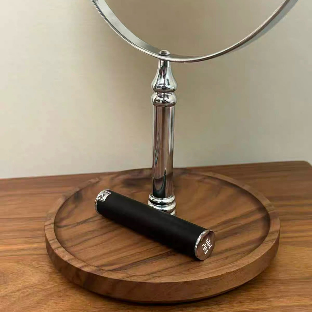 Modern tabletop vanity mirror with warm lighting feature