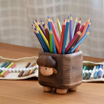 Natural walnut pen cup with smooth grain finish