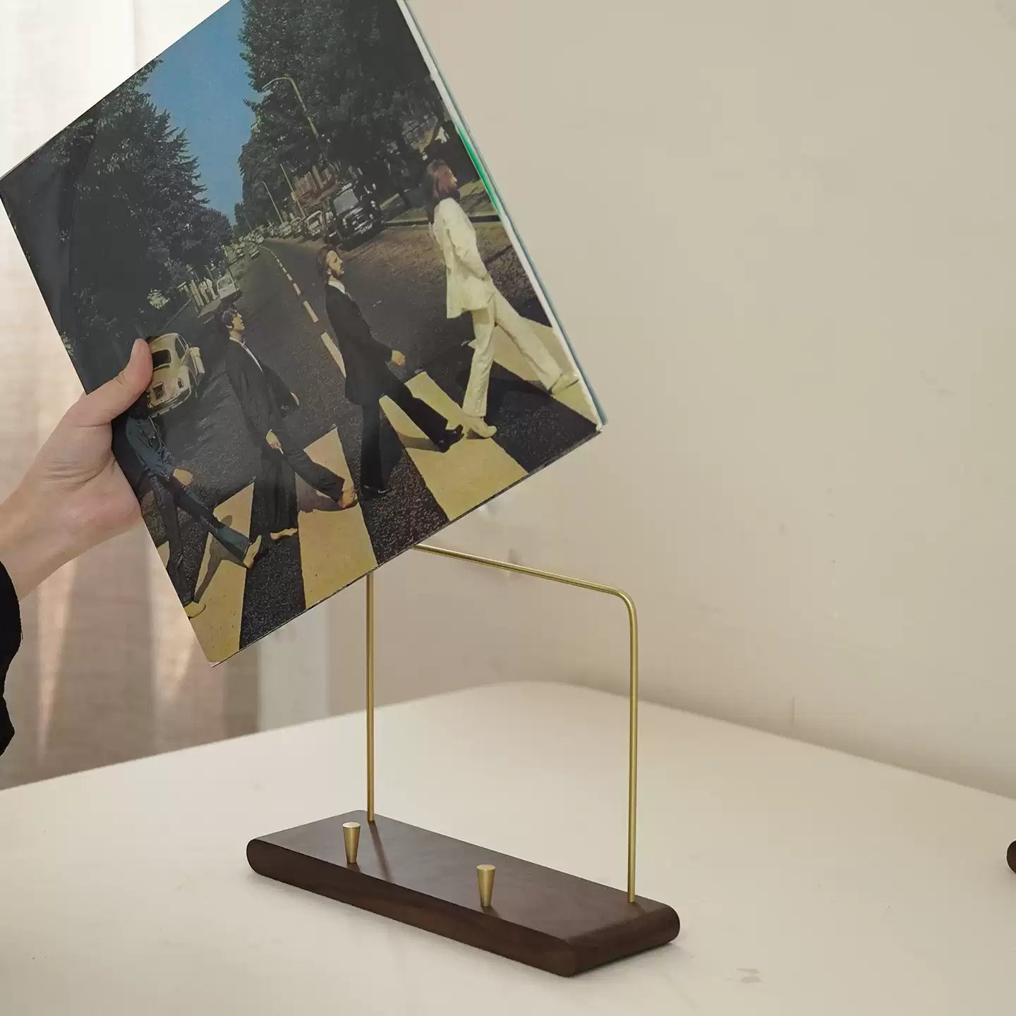 Natural wood CD display stand with smooth walnut grain finish