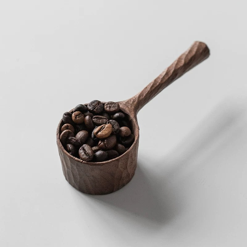 Natural wood coffee scoop with smooth walnut grain finish