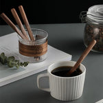 Natural wood coffee stir sticks with smooth walnut grain finish
