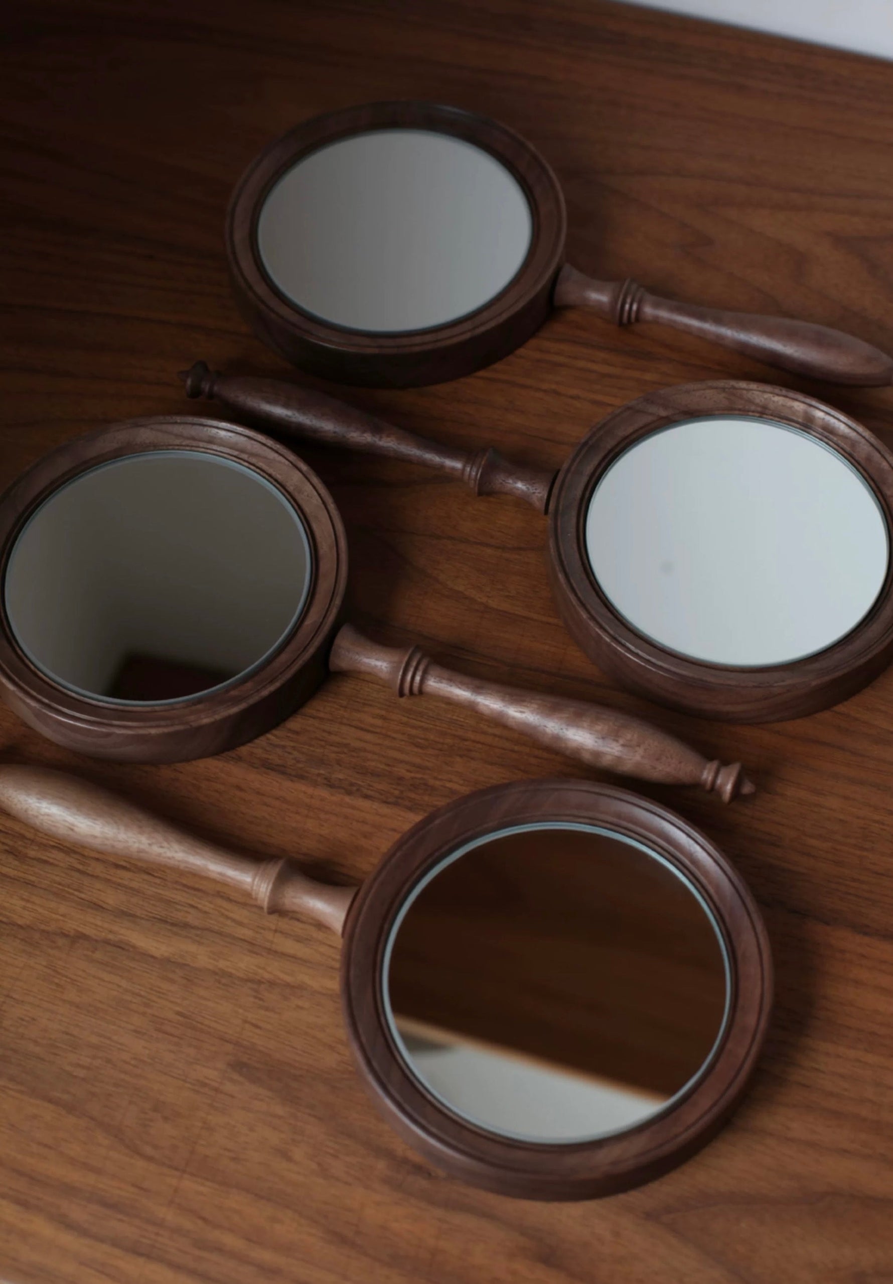 Natural wood handheld mirror with smooth walnut grain finish