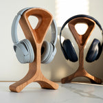 Natural wood headphone stand with smooth walnut grain finish