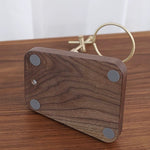 Natural wood pour-over coffee stand with smooth walnut grain finish