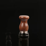Natural wood wine plug with smooth walnut grain finish