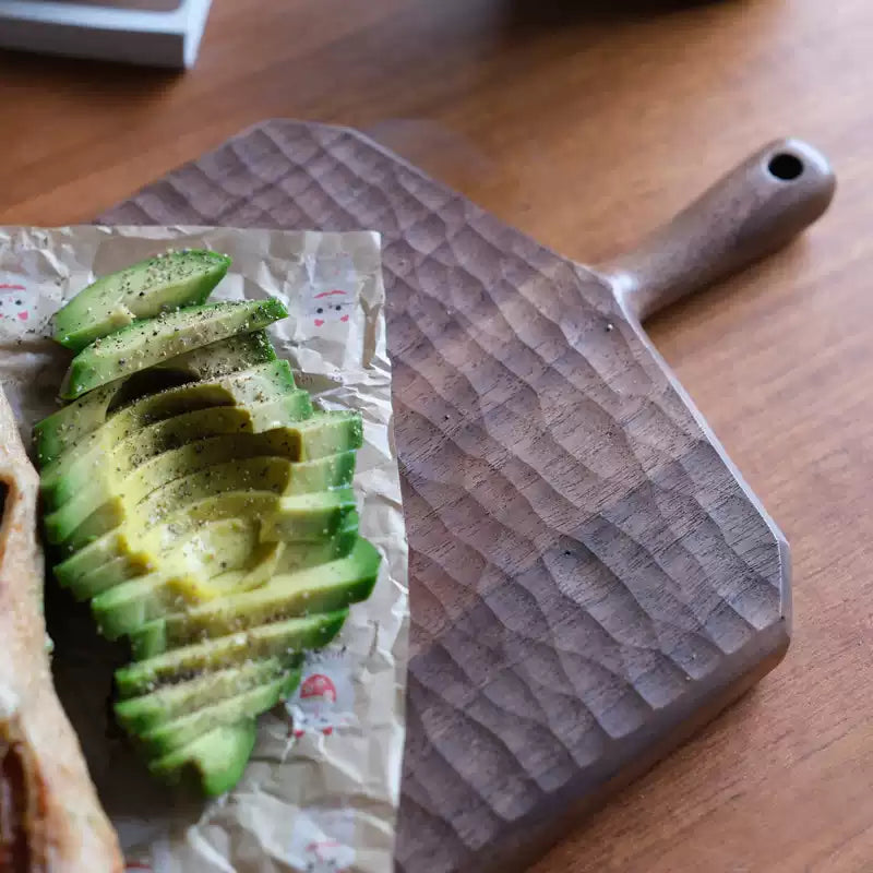 Sculpted solid walnut serving board with unique design