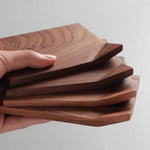 Solid walnut coaster set with unique rolled edge design