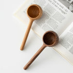 Handcrafted solid walnut coffee scoop with minimalist design