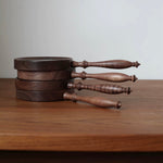 Solid walnut hand mirror with elegant vintage appearance