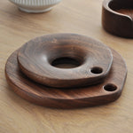 Solid walnut trivet with cutout design
