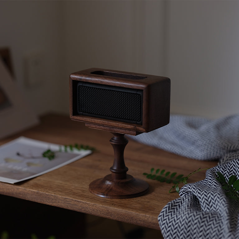 Natural wood speaker riser with smooth walnut grain finish