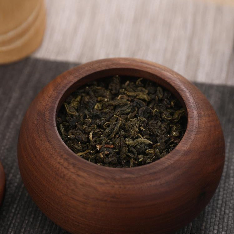 Wooden tea storage jar with elegant leaf inspired design