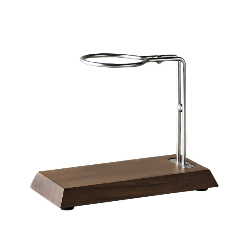 A wooden and metal tabletop ring holder with a dark brown wood-grain base and a silver metal stand, shown on a plain white background.