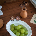 Natural wood fruit picks with smooth walnut grain finish